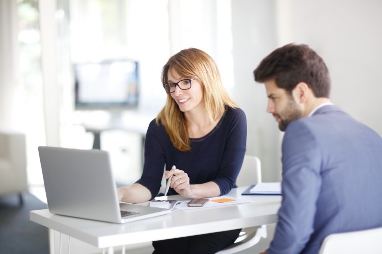 An accountant reviews tax information with a client.