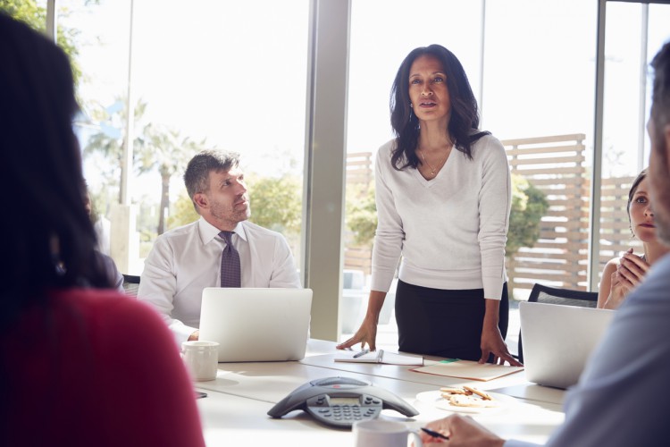 A CFO leads a team meeting.