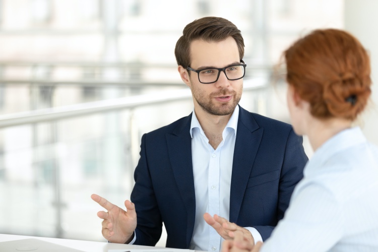 An account executive meets with a client.