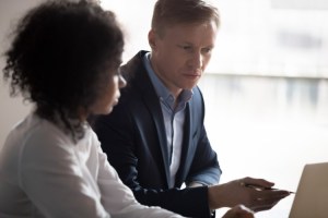 A machine learning engineer reviews information on their computer.