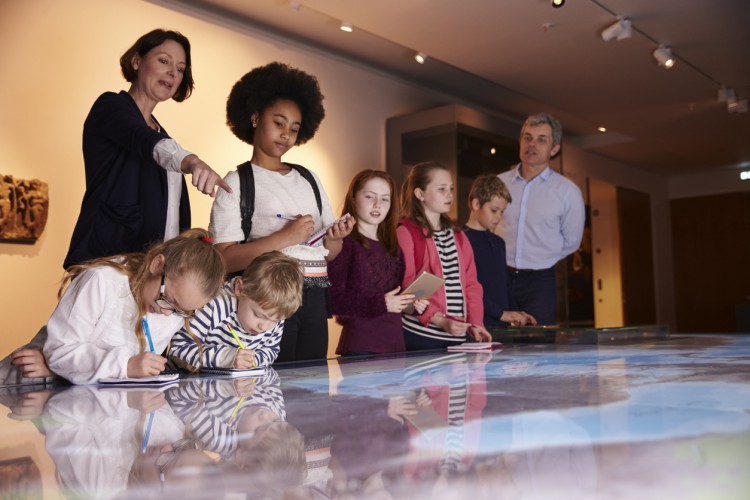 A museum educator with students.