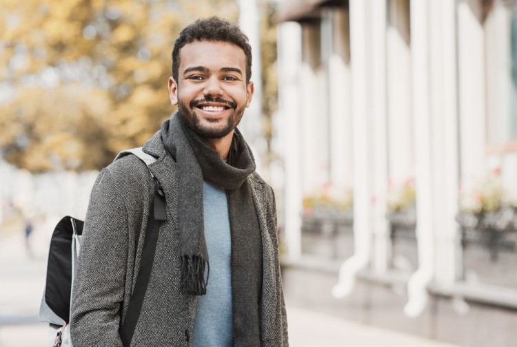 a smiling student on campus