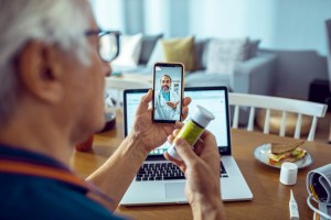 A patient consults with a doctor via a telehealth appointment.