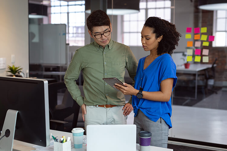 two people standing and talking to each other