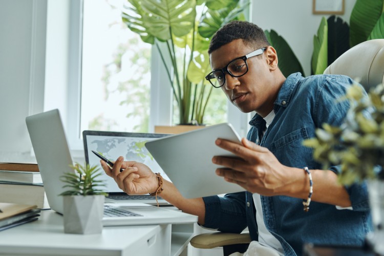 data analyst holding a tablet