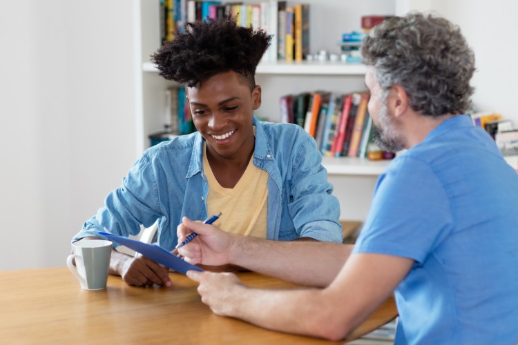 An admission counselor meets with a student.