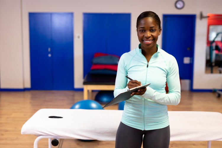 A smiling athletic trainer