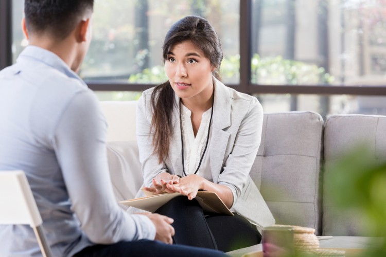 A counselor meets with a client.