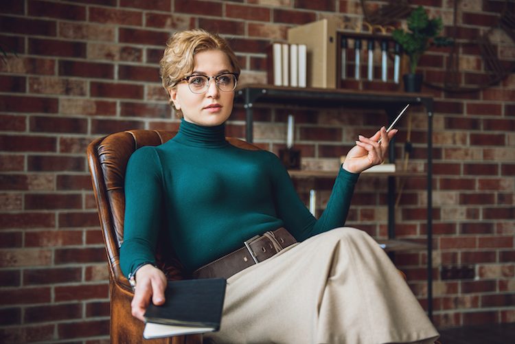 Female psychologist with book