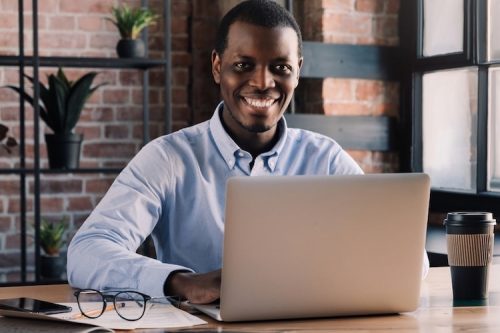 Legal editor works on his legal blog at a coffee shop.