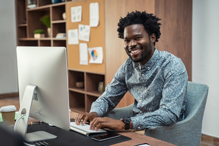 Marketing professional working with a computer.