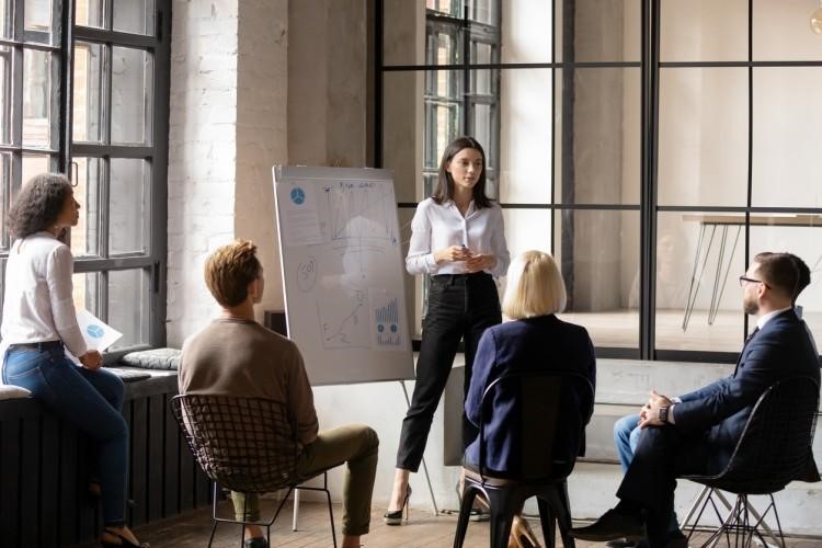 A financial manager presents an investment plan to executives.