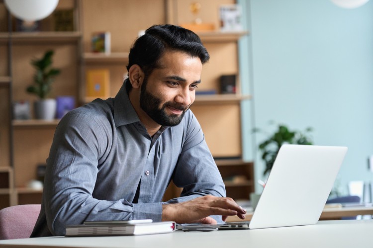 An MBA student views an online lecture.