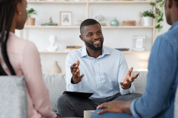 A psychologist meets with clients.