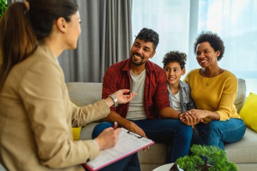 A social services worker helping a family.