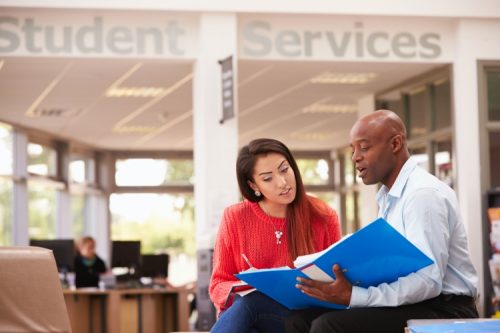 A college department chair meets with a student.