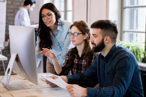 Digital communication professionals work on a project.