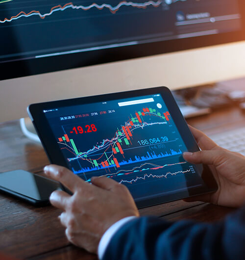 Person looking at the stock market on a tablet